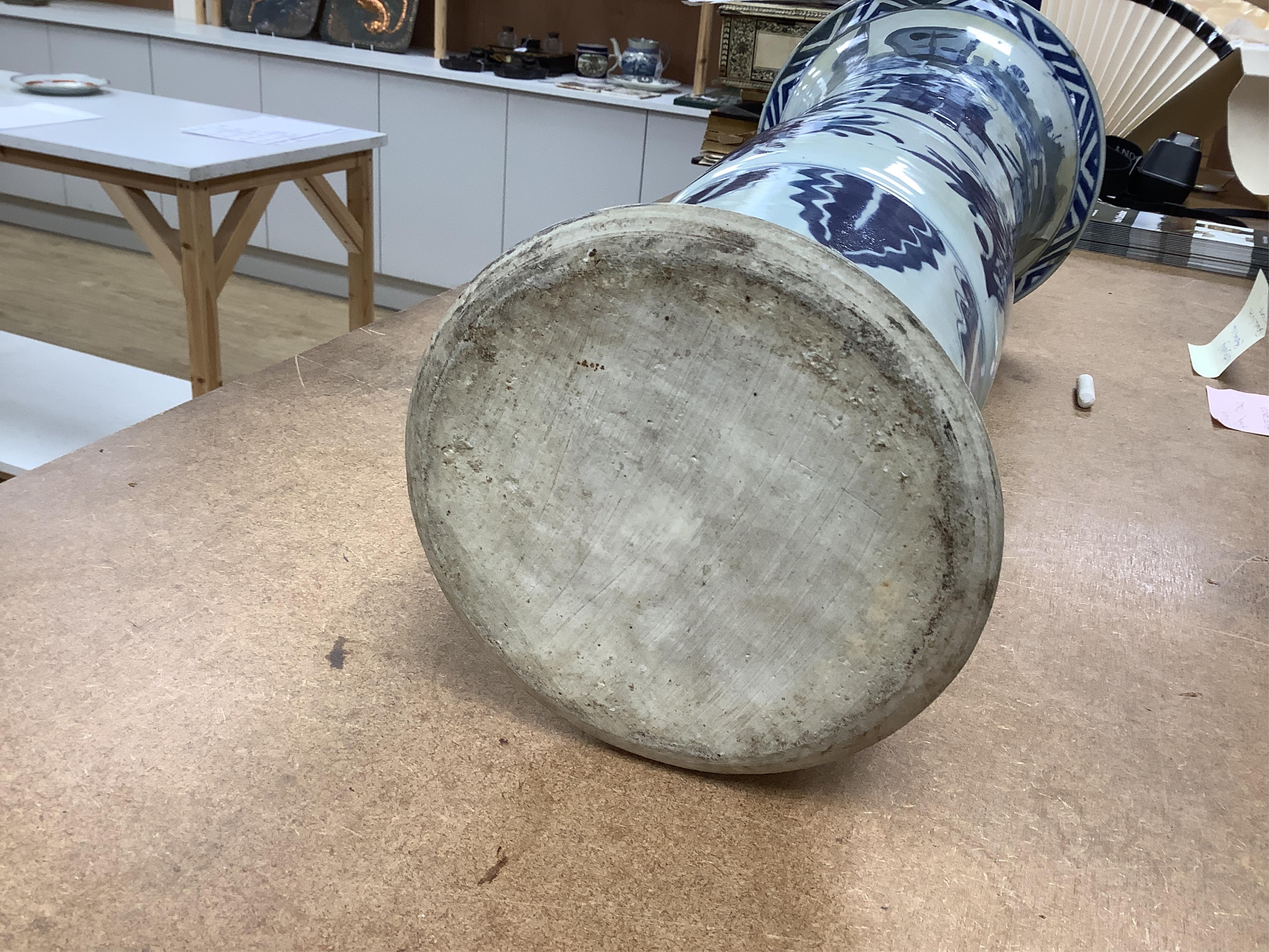 A Chinese blue and white sleeve vase. 53cm high. Condition - heavily restored.